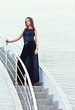 portrait of a beautiful brunette woman in a black dress. portrait of a beautiful brunette woman in a black dress.