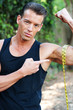 Photo: Muscular man measuring bicep Muscular man measuring bicep