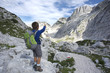 Little boy loooking at mountain view