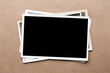Stack of old photos on gray cardboard background