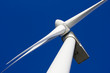 A wind-turbine against a clear blue sky