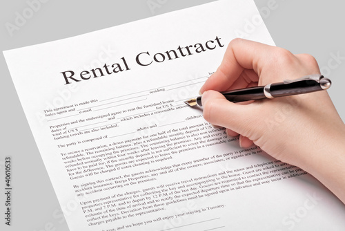 Photo: Rental contract form with pen Rental contract form with pen