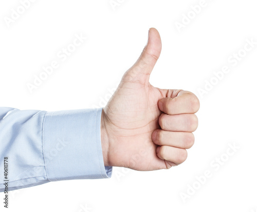 Photo: Male hand showing thumbs up or like symbol isolated on white bac Male hand showing thumbs up or like symbol isolated on white bac
