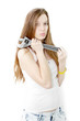beautiful girl keeps in the hands wrench