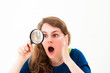young woman through a magnifying glass young woman through a magnifying glass