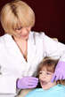 female dentist and little girl patient female dentist and little girl patient