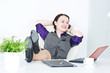 Business woman talk on telephone with legs on the table