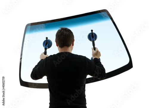 Photo: man holding up the windshield man holding up the windshield