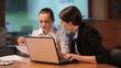 Two women working with computer