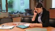 Young businesswoman talking on the phone in office