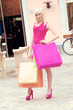 Young blonde shopping woman with bags. Young blonde shopping woman with bags.