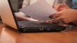 Young women working with laptop, close up