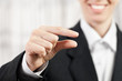Businesswoman pinching finger sign
