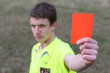 young boy and red card
