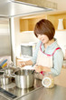 Beautiful young woman in kitchen