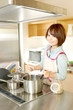 Beautiful young woman in kitchen