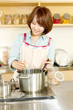 Beautiful apron woman in the kitchen