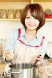 Beautiful young woman in kitchen