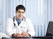 Portrait of happy doctor at office