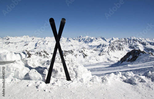 Illustration: Pair of cross skis in snow Pair of cross skis in snow