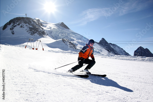 Photo: Skier in high mountains Skier in high mountains