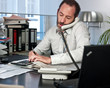 Businessman working while on the phone