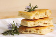 Photo: Pieces of italian bread focaccia and fresh herbs Pieces of italian bread focaccia and fresh herbs