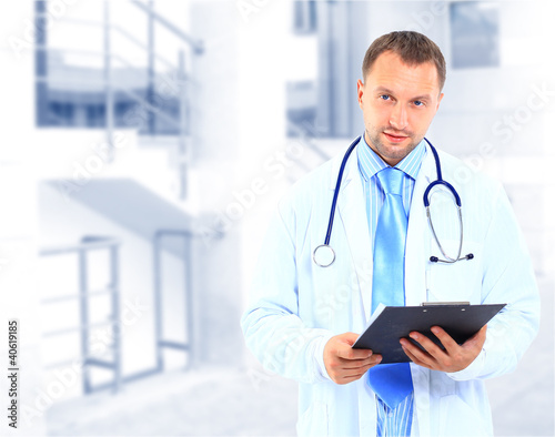 Photo: portrait of doctor in white coat and stethoscope portrait of doctor in white coat and stethoscope