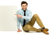 Man pointing at blank poster