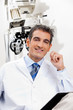 Smiling Optometrist At His Clinic