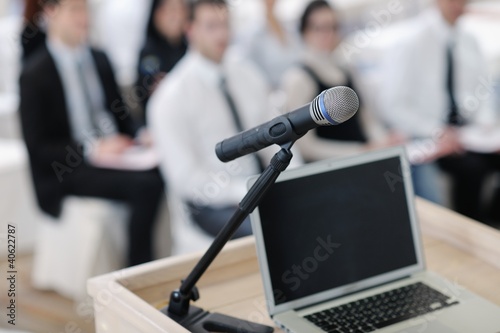 Photo: laptop on conference speech podium laptop on conference speech podium