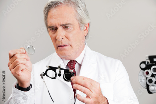 Photo: Optometrist Checking the Lens Of Trial Frame Optometrist Checking the Lens Of Trial Frame