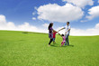 Happy Asian Family in Meadow Happy Asian Family in Meadow