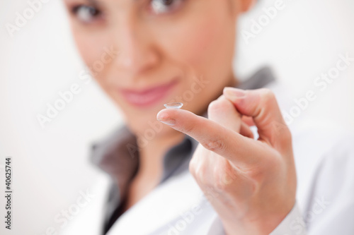 Photo: Optometrist Showing Contact Lens Optometrist Showing Contact Lens