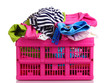 canvas print picture - Clothes in pink plastic basket isolated on white