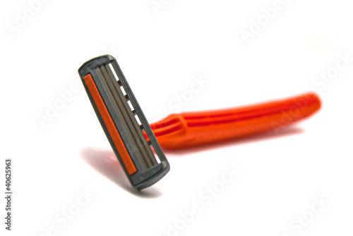 Photo: orange razor blades on white orange razor blades on white
