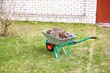 hand cart filled with dry leaves in the spring hand cart filled with dry leaves in the spring