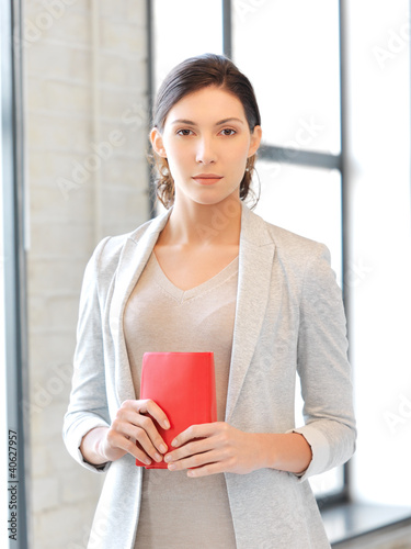 Photo: calm and serious woman with book calm and serious woman with book