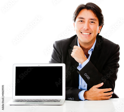 Foto: Business man with a laptop Business man with a laptop
