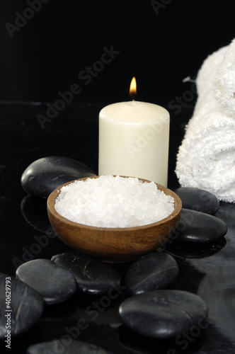 Photo: Still life with herbal salt in bowl and candle with towel Still life with herbal salt in bowl and candle with towel