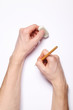 Image of human hands with pencil and eraser on white Image of human hands with pencil and eraser on white