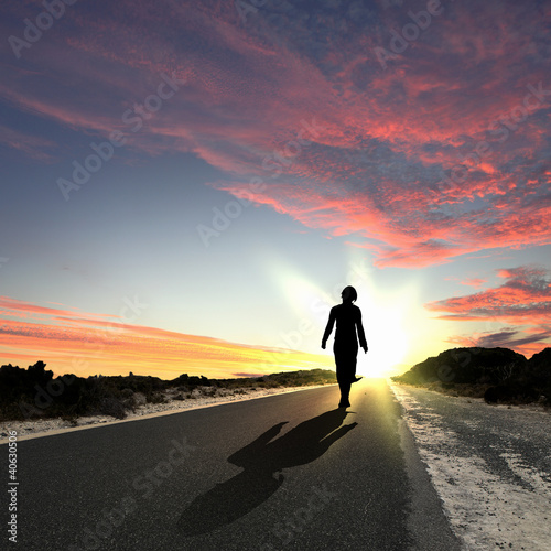 Illustration: Man walking away at dawn along road Man walking away at dawn along road