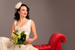 Portrait of a beautiful happy bride on red sofa Portrait of a beautiful happy bride on red sofa