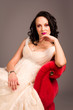 Portrait of a beautiful happy bride on red sofa Portrait of a beautiful happy bride on red sofa