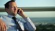 Businessman on the phone, outdoors