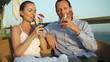 Couple having drinks and relaxing at an outdoor restaurant