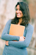 Portrait of young ,brunette,woman student in the park Portrait of young ,brunette,woman student in the park