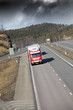 trucking on freeway, dark storm clouds trucking on freeway, dark storm clouds