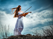 The red-haired girl with a violin outdoor