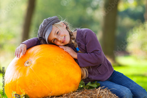 Photo: girl with huge pumpkin girl with huge pumpkin